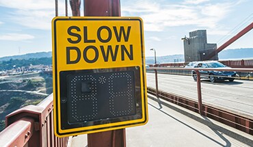 2022 Nissan Kicks slow down sign on side of road illustrating customizable alerts