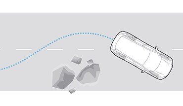 2022 Nissan Kicks illustration showing anti-lock braking around a large rock
