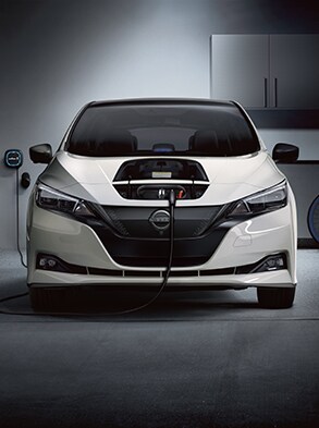 2024 Nissan LEAF being charged in a home garage