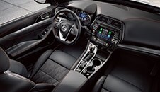 2022 Nissan Maxima cockpit showing driver controls and touch-screen connected technology