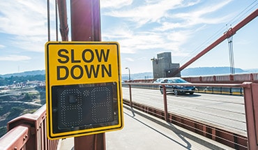 2023 Nissan Maxima slow down sign on roadside illustrating customizable alerts.