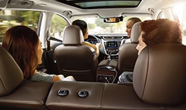 2023 Nissan Murano interior seen from the back with 4 people in the car.