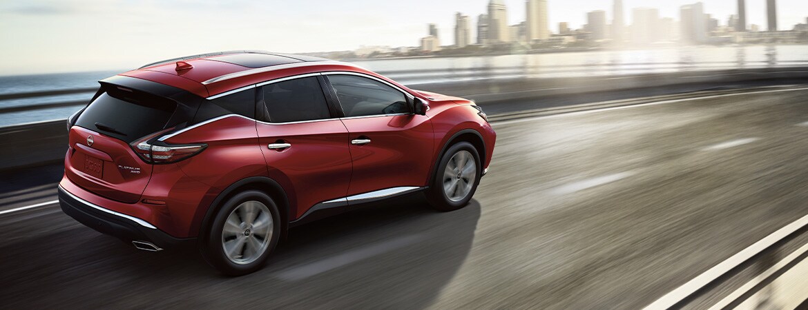 2023 Nissan Murano driving swiftly on highway to illustrate suspension and handling.