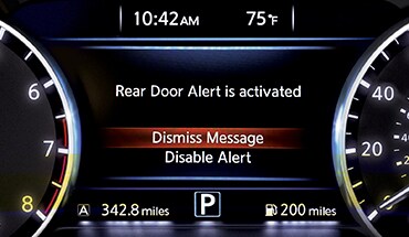 2023 Nissan Murano gauge screen displaying rear door alert.