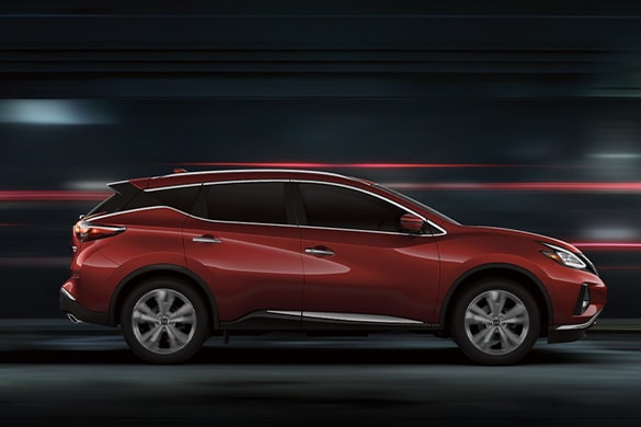2023 Nissan Murano in profile at night showing floating roof design.