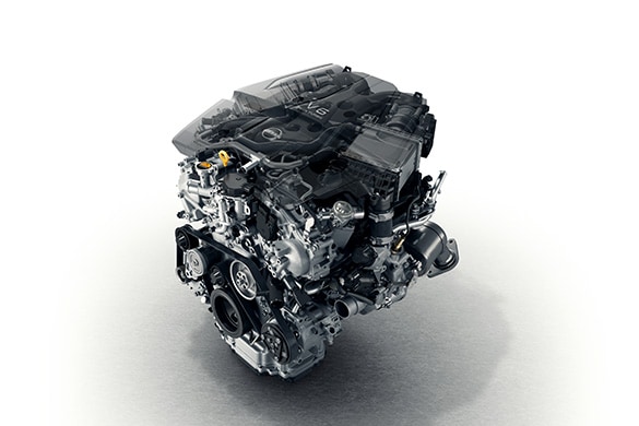 2023 Nissan Z V6 twin-turbo engine on a white background.