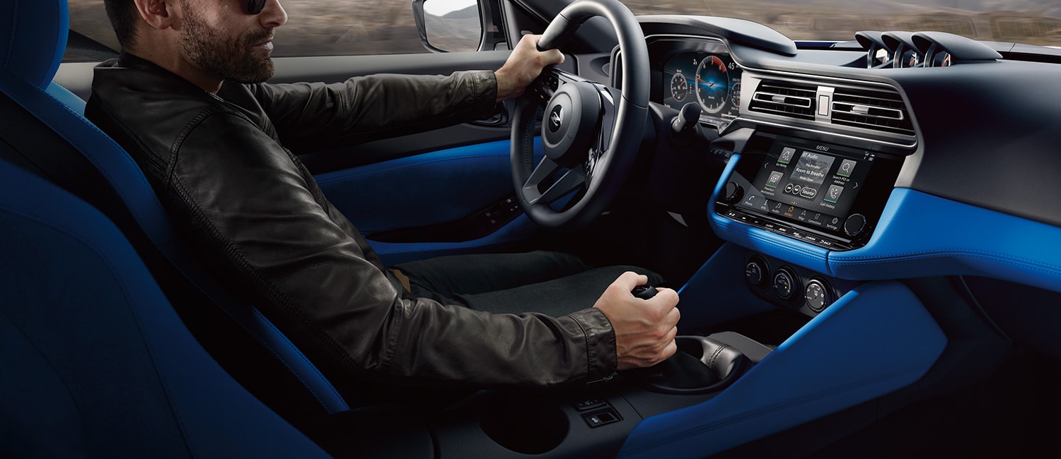 2023 Nissan Z person in cockpit with blue interior.