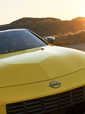 2023 Nissan Z in yellow close up of front iconic hood bulge.