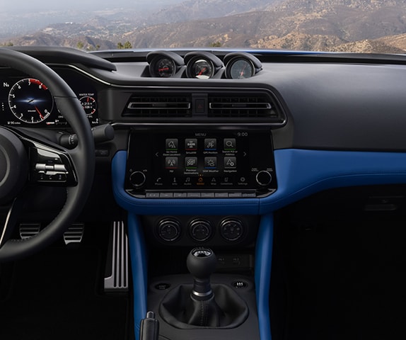 2024 Nissan Z interior view showing triple pod cluster, air vents, and audio controls