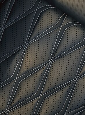 2023 Nissan Rogue view of quilted black leather seats with contrast stitching.