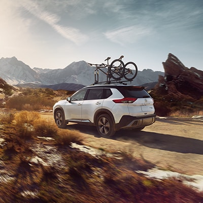 2023 Nissan Rogue off-roading with bikes on roof rack