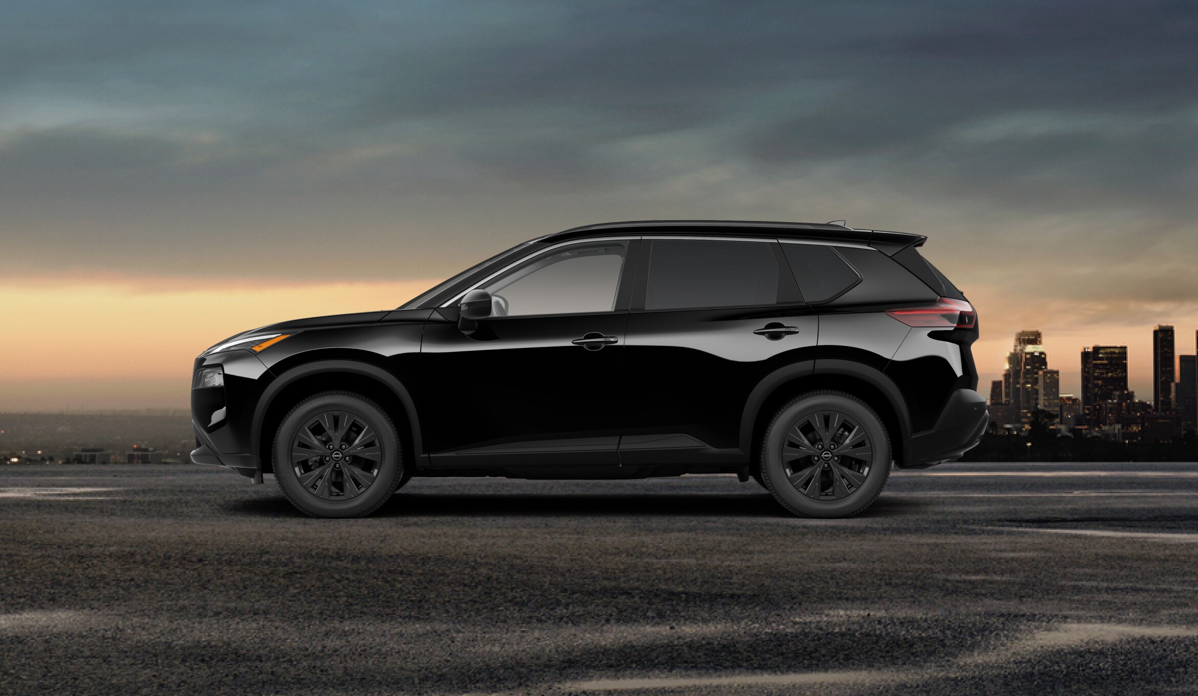 2023 Nissan Rogue Midnight Edition presented in a sleek black side view.