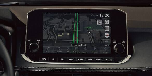 2023 Nissan Rogue touch-screen showing door-to-door navigation with premium traffic.
