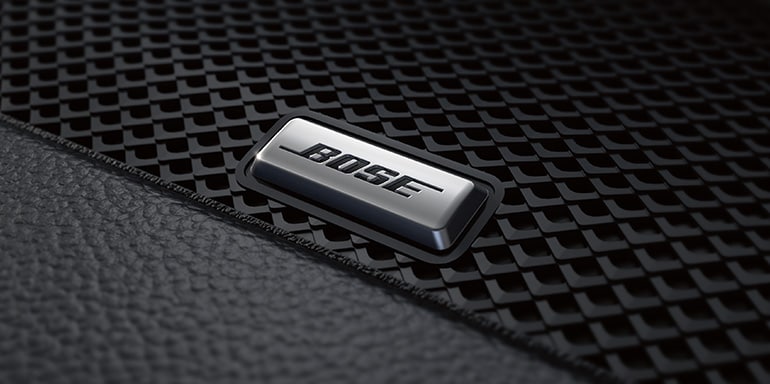 2024 Nissan Rogue detail view of Bose speaker logo plate