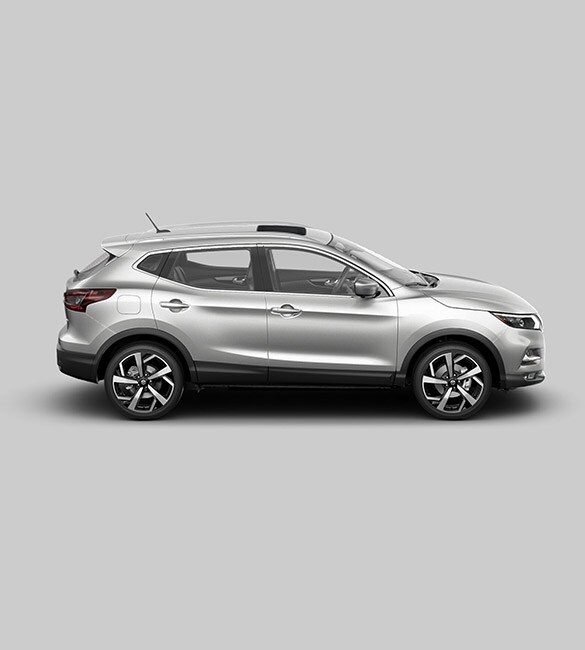2021 Nissan Rogue Sport in silver in profile with white background