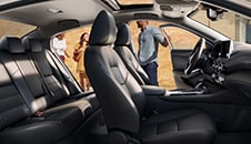2022 Nissan Sentra seen from the passenger side, drivers side front and rear doors illustrating spacious interior.