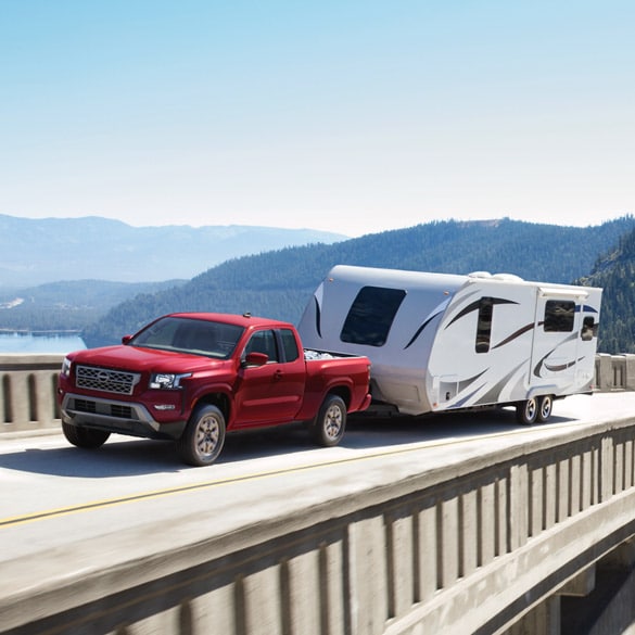 Nissan Frontier Mid-Size Truck Towing a Camper