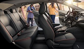 2022 Nissan Versa showing spacious interior as people get in front and back seats.