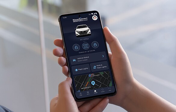 2023 Nissan Versa, handheld device showing NissanConnect app.