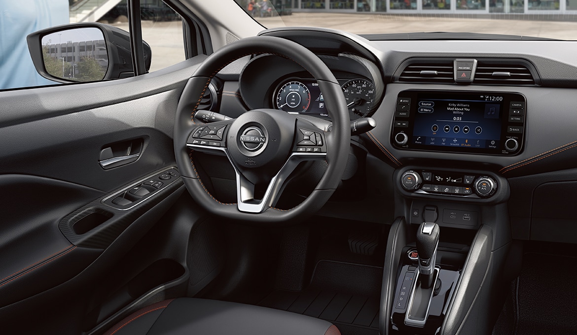2024 Nissan Versa interior view showing cockpit and dashboard, with contrasting stitching and attention to detail