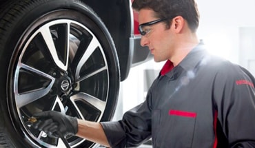 Nissan Technician Doing Tire Maintenance